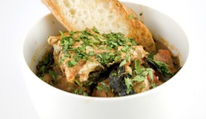 Sausage, Kale, and Tomato Ragout with Poached Eggs